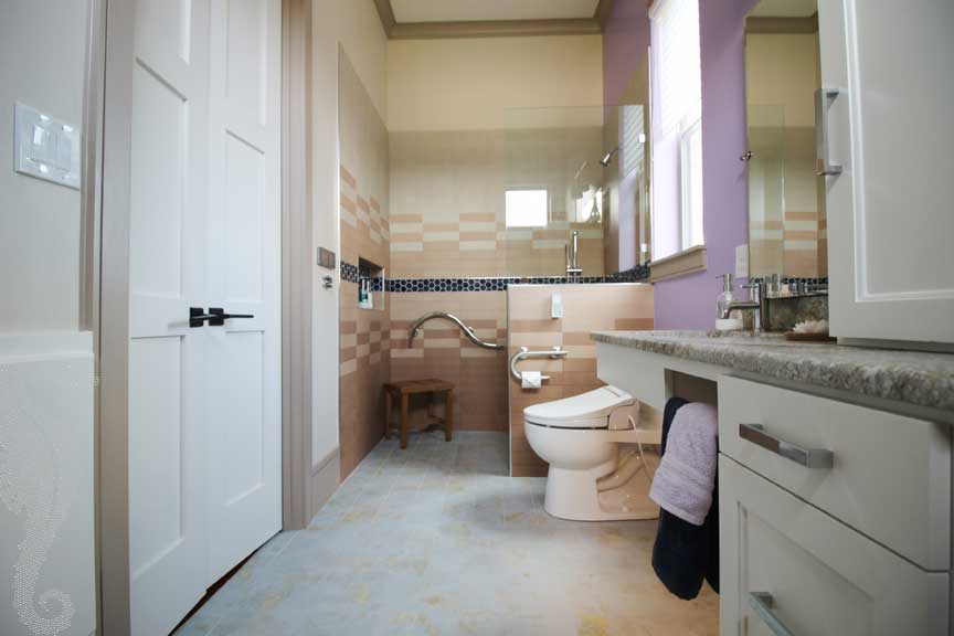 French Mediterranean style handicapped accessible bathroom.