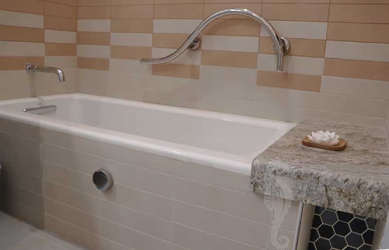 Aging in place accessible bathtub with non-slip surfaces and an